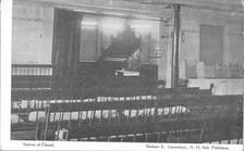 SA1608 - Interior of meeting house, showing benches and organ. Identified on the front., Winterthur Shaker Photograph and Post Card Collection 1851 to 1921c